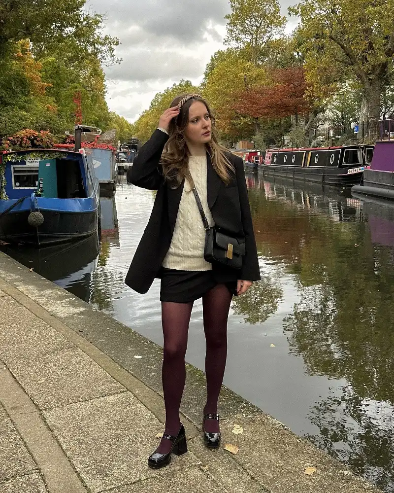 Black Oversized Blazer with Cable-Knit Sweater, Burgundy Tights, and Mary Jane Heels