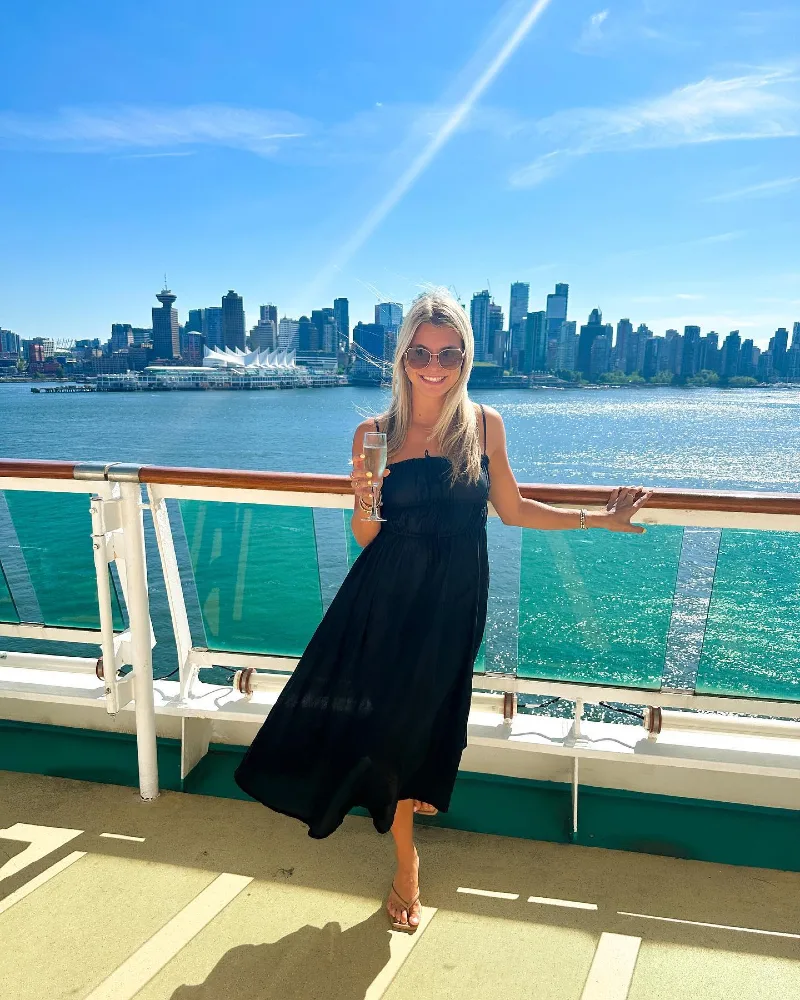 Black Spaghetti Strap Midi Dress with Sunglasses and Sparkling Drink