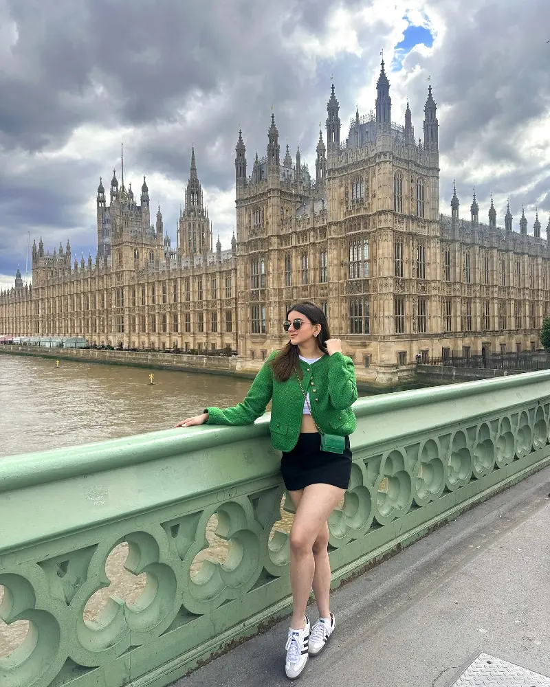 Emerald Green Tweed Cropped Jacket with Black Mini Skirt and Matching Green Crossbody Bag