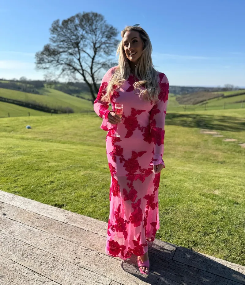 Pink Sheer Long-Sleeve Maxi Dress with Red Floral Appliques and Matching Heels