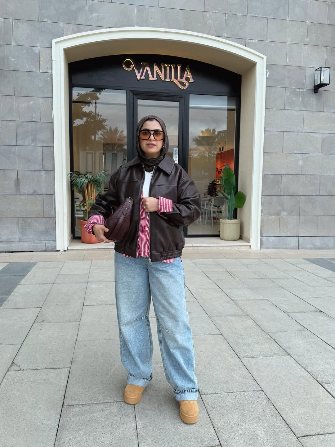 Casual Brown Faux Leather Jacket & Striped Button-Up With Light Wide-Leg Jeans