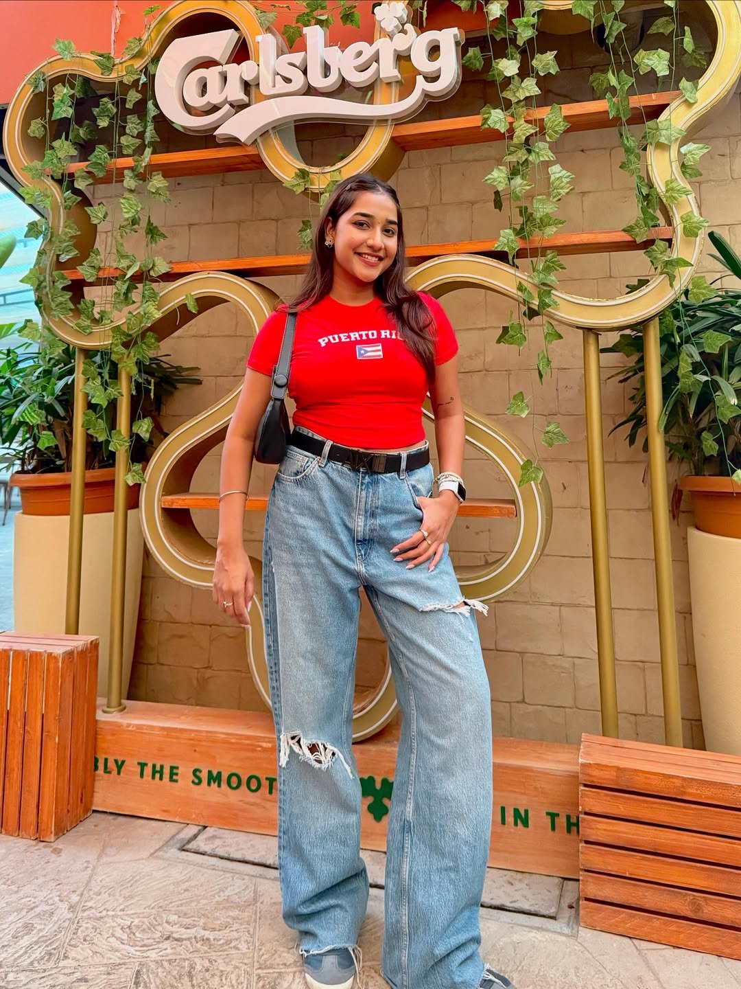 Vibrant Red and Distressed Denim Effortless Concert Style