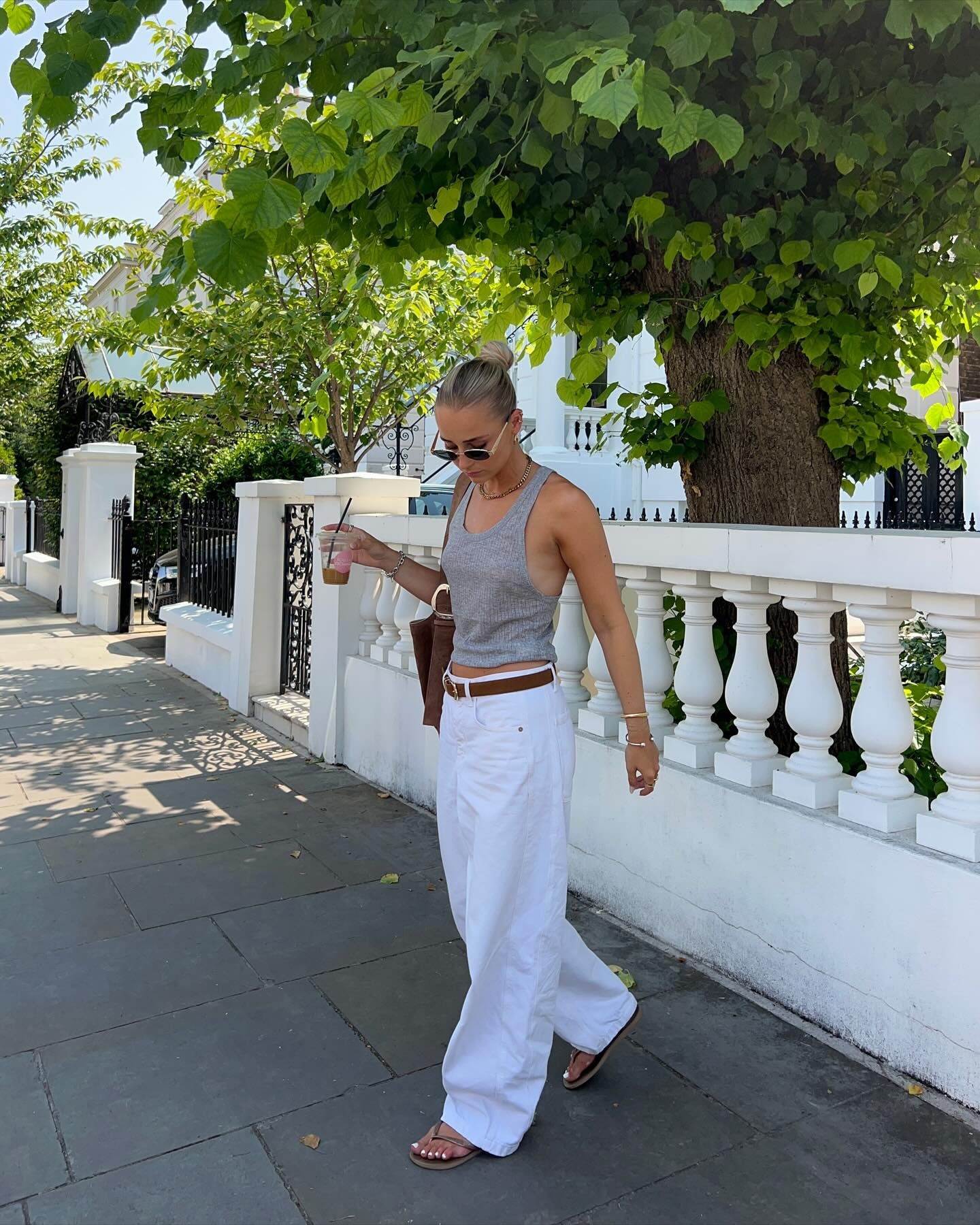 Baggy White Denim with Grey Ribbed Tank Top and Cognac Leather Accessories
