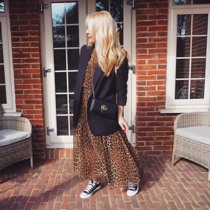 Black Blazer with Beige Base Top and Leopard Midi Skirt by Classic Brick Facade