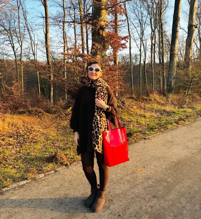 Black Knit Layer with Leopard Scarf Accent and Bright Red Tote in Autumn Park Light