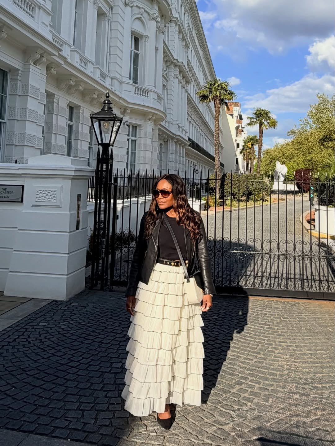Black Leather Jacket with Tiered Cream Maxi Skirt near Grand Townhouses