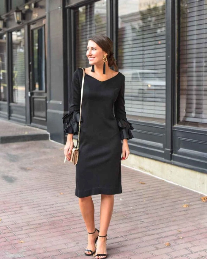 Black Ruffle Sleeve Midi Dress with Gold Chain Clutch on City Street