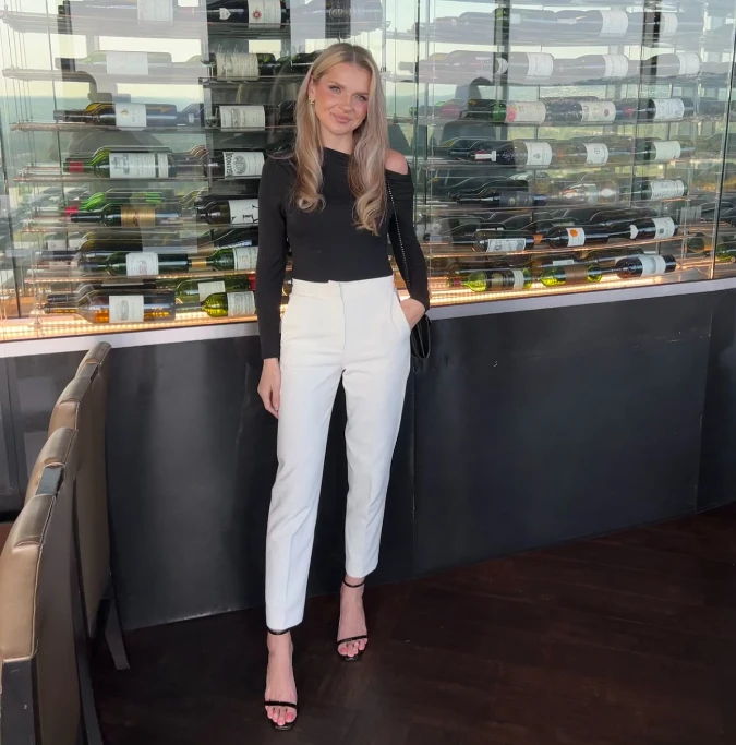Black Shoulder Cutout Top and White Slim Trousers for a Sleek Anniversary Dinner Look