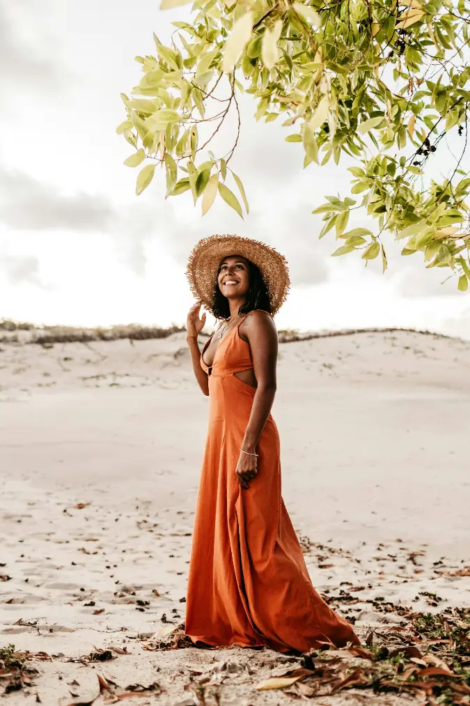 Burnt Orange Maxi Dress with a Wide Straw Hat