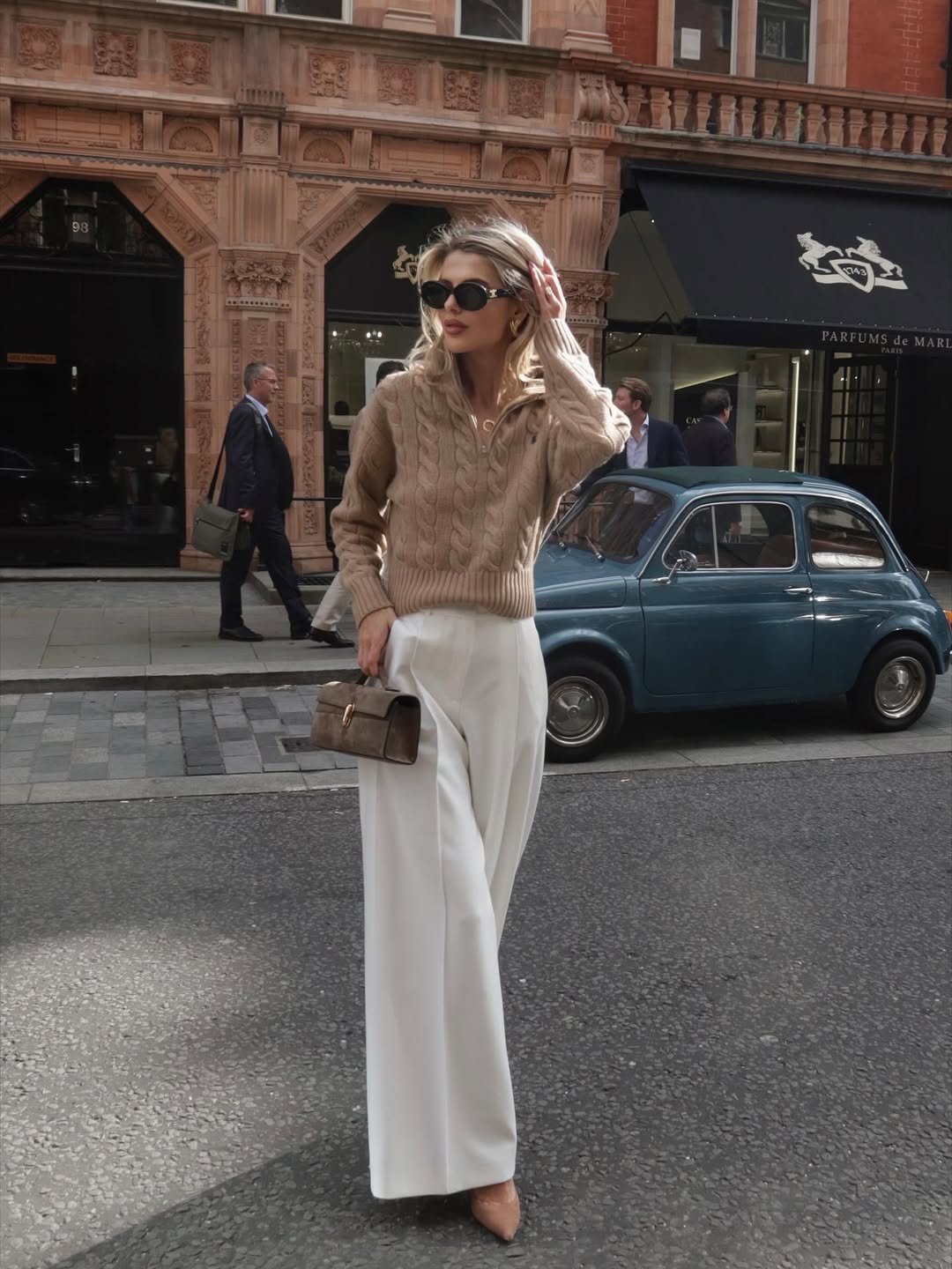 Cable-Knit Quarter-Zip Sweater with High-Waisted Wide-Leg Trousers and Suede Clutch