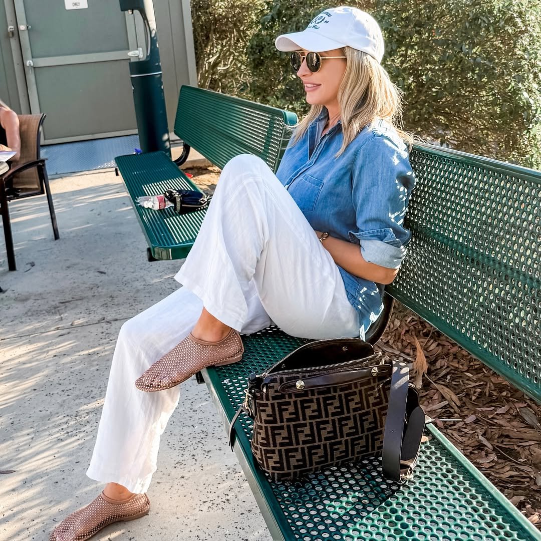 Chambray Button-Down Shirt with Wide-Leg White Linen Pants and a Classic Baseball Cap
