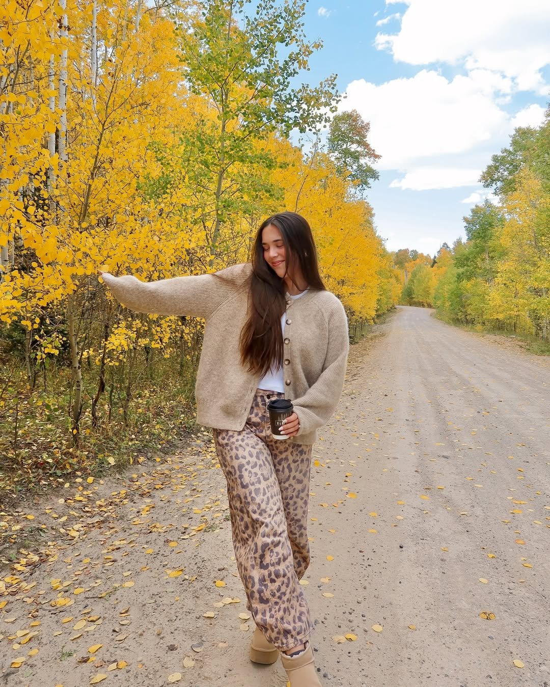 Chunky Beige Cardigan with Leopard Print Trousers and Platform Slippers