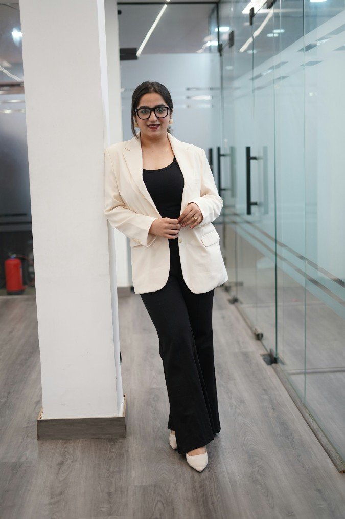Cream Blazer with Black Base and Soft Neutral Office Minimalism in Glass Corridor