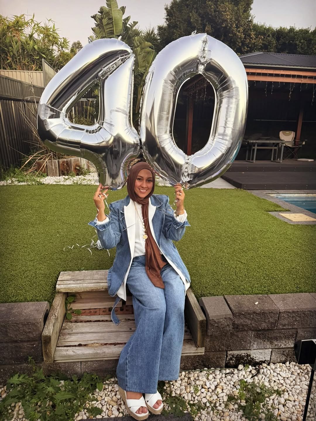Denim Blazer and Wide-Leg Jeans with Silver Balloons on Garden Steps