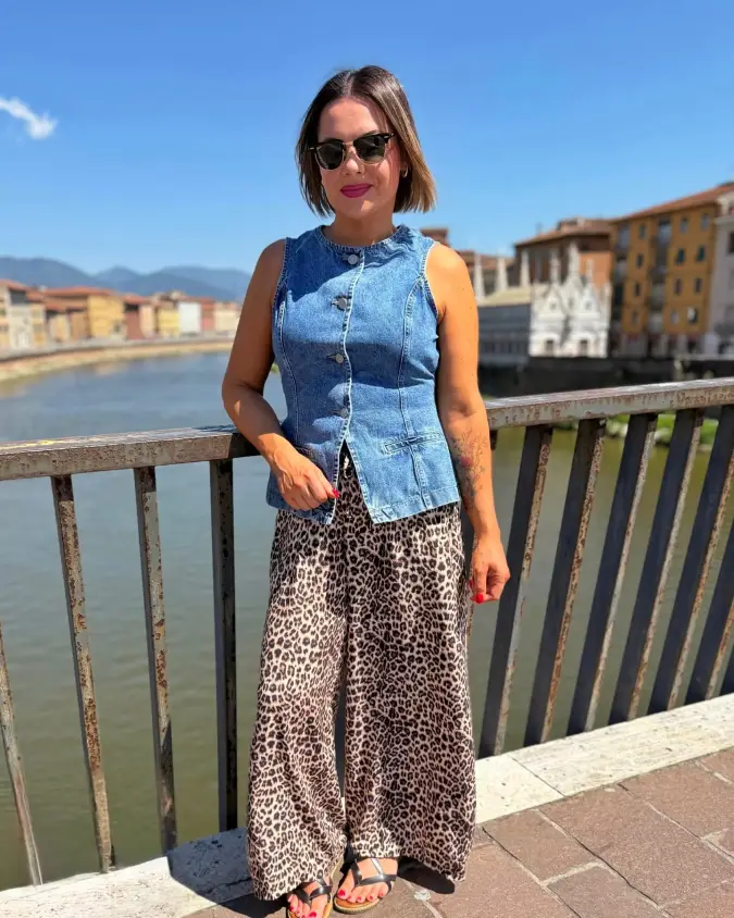Denim Vest with Leopard Wide-Leg Pants on Riverfront Bridge in Bright Sunlight