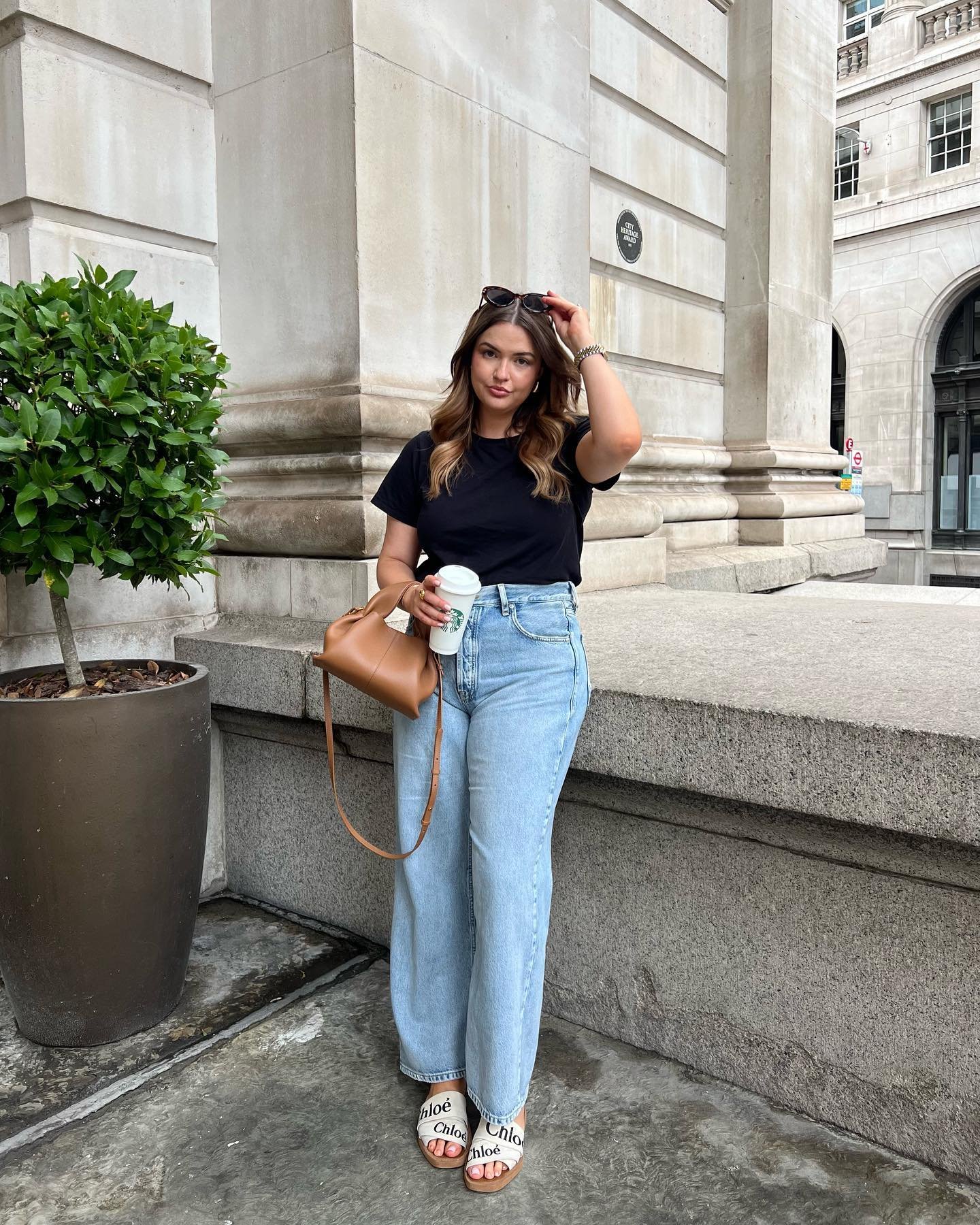 High-Waisted Light Denim with Classic Black Tee and Logo Slides