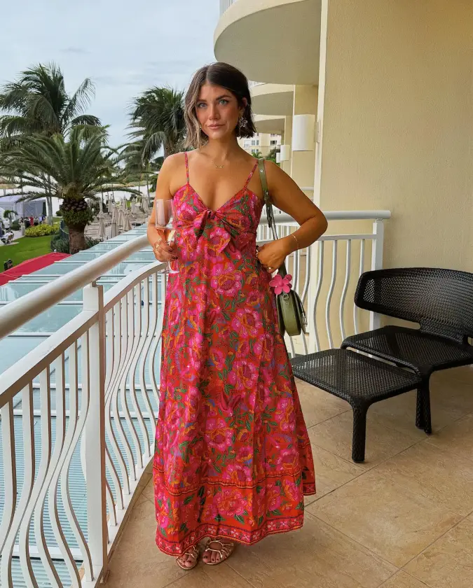 Hot Pink Floral Maxi Dress on a Resort Balcony
