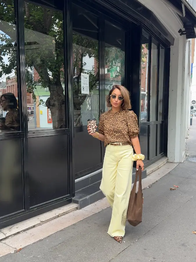 Leopard Blouse with Cream Trousers and Black Blazer in Modern Street Light