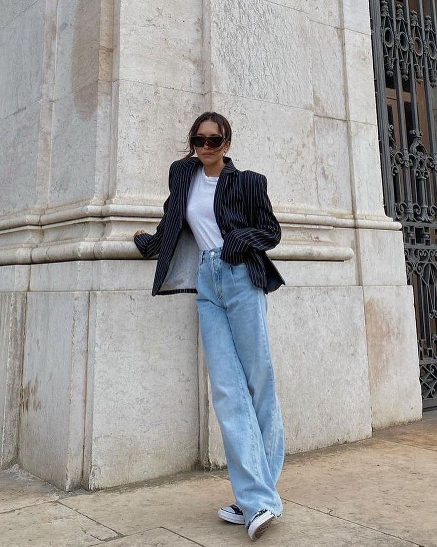 Light Blue Pleated Denim with Pinstripe Blazer and Sneakers