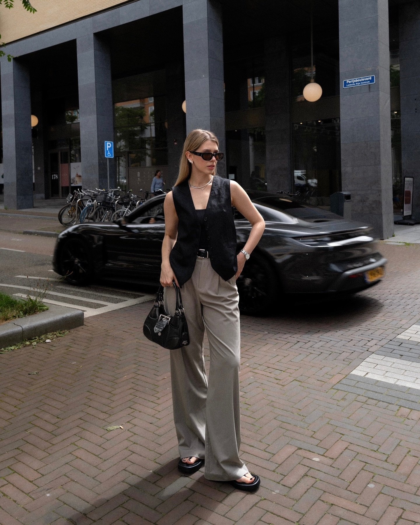 Light Grey Trousers with Tailored Black Waistcoat and Chunky Sandals