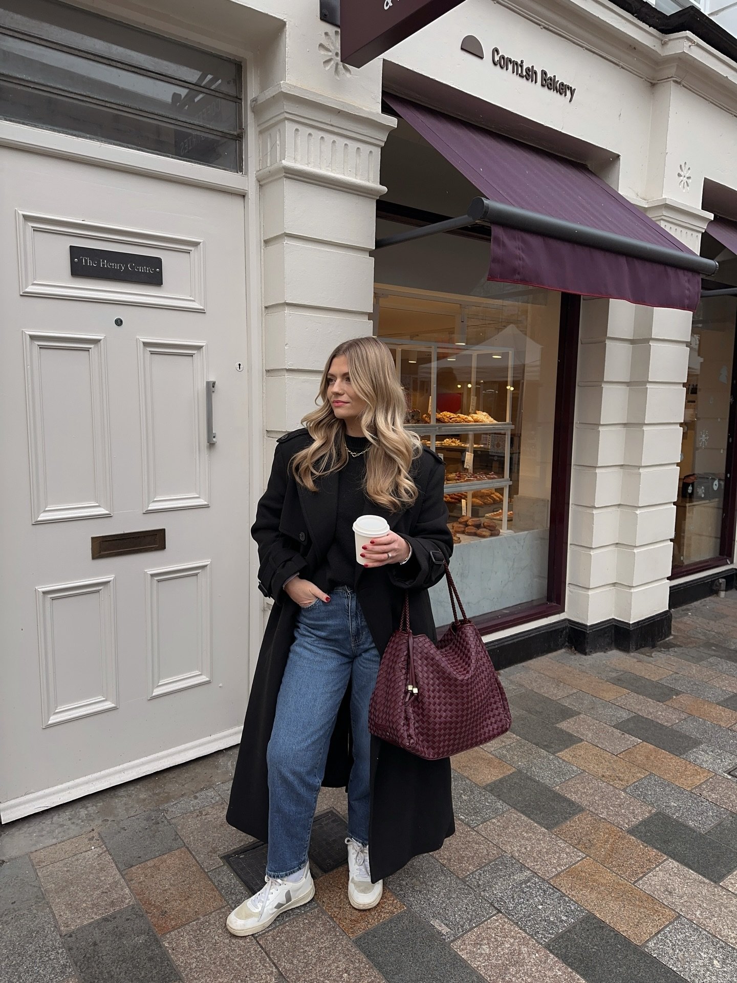 Long Black Wool Coat with Woven Burgundy Tote and Medium Wash Denim
