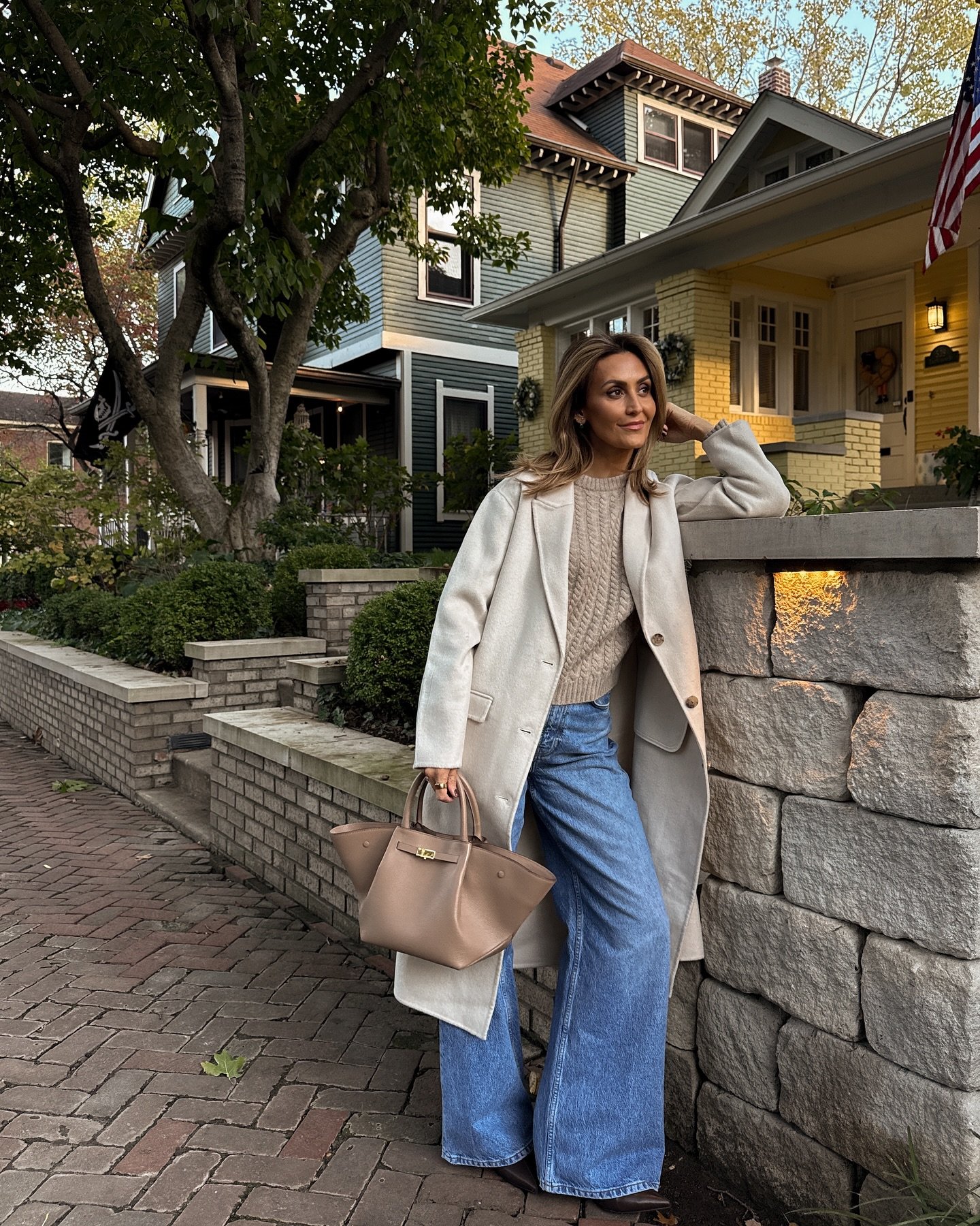 Mid-Wash Wide-Leg Jeans with Cable-Knit Sweater and Long Cream Duster