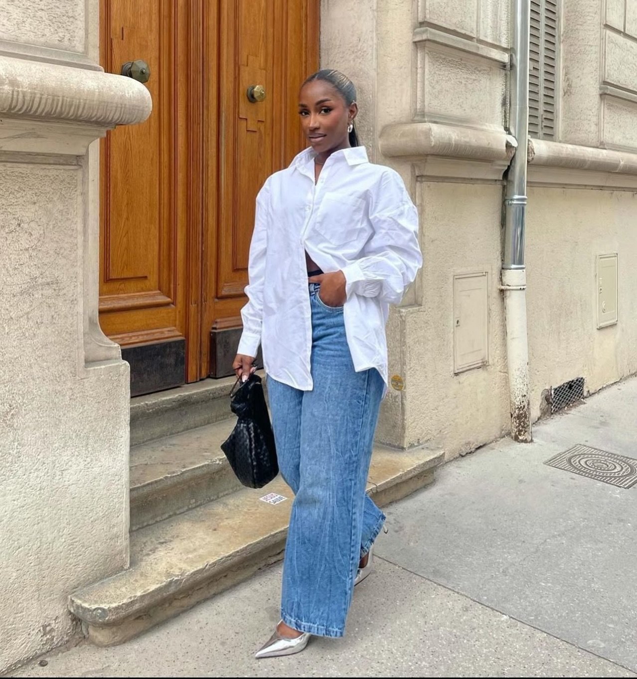 Mid-Wash Wide-Leg Jeans with Oversized Asymmetrical White Button-Down and Metallic Heels