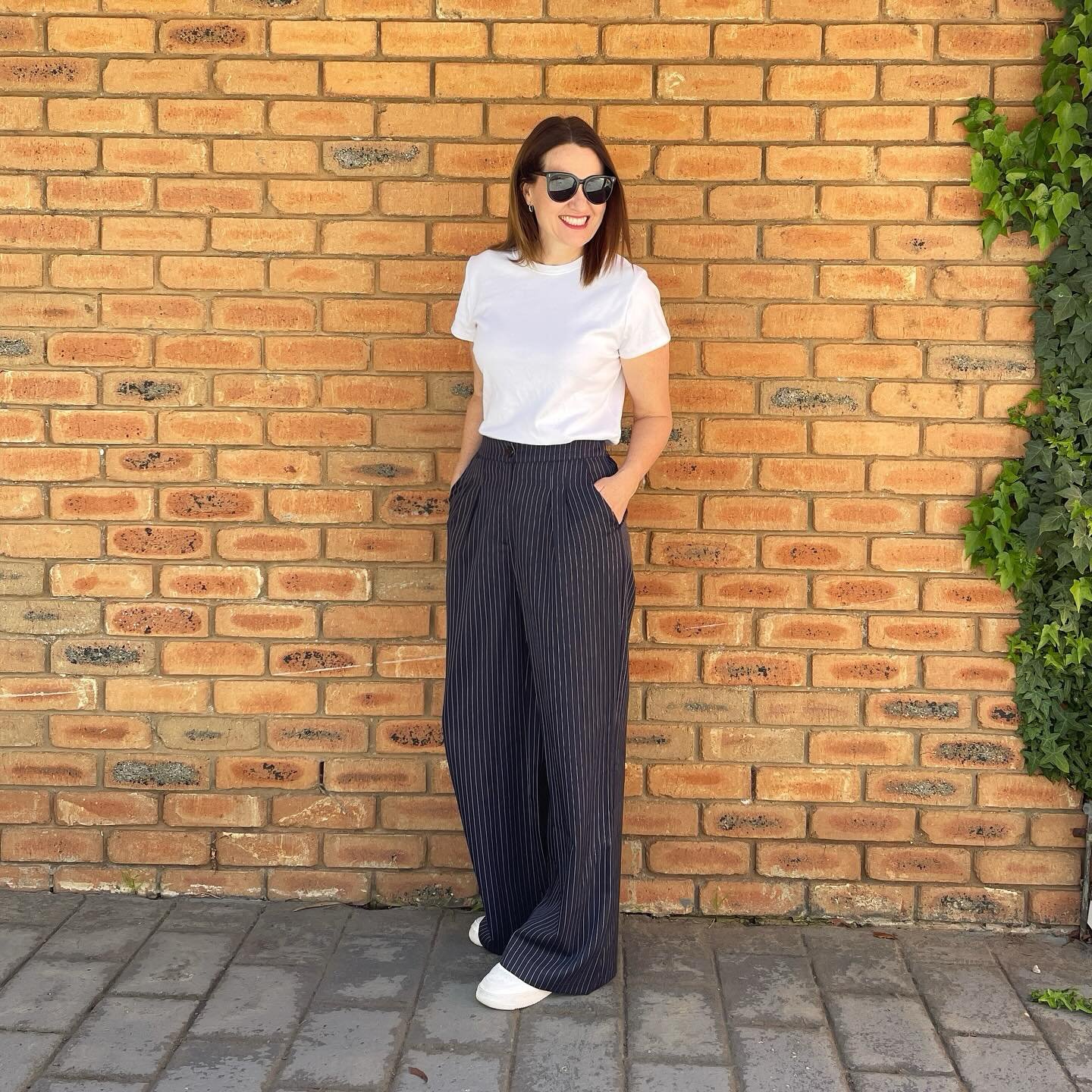 Navy Pinstripe Wide-Leg Pants with Crisp White T-Shirt and Sneakers