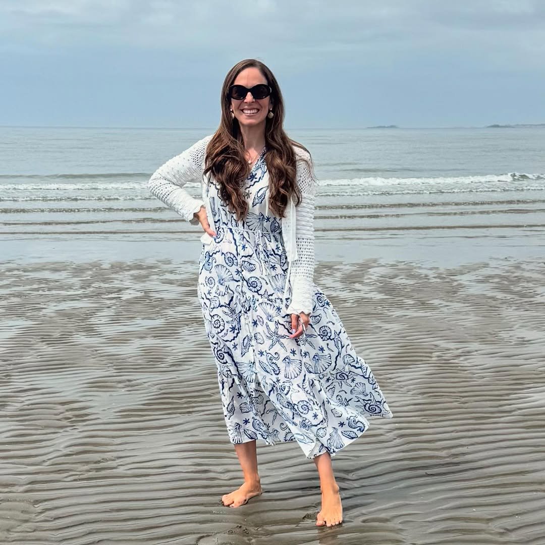 Ocean Motif Maxi Dress with an Open-Stitch White Cardigan on the Shore