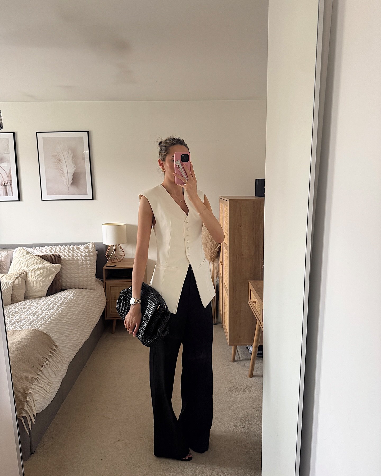 Pitch Black Trousers with Long White Tailored Vest and Woven Clutch