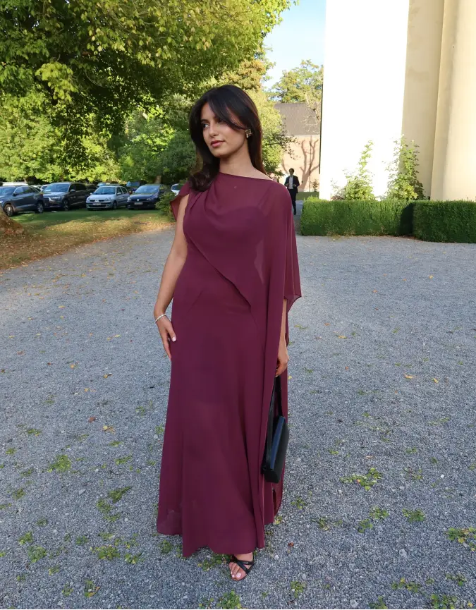 Plum Chiffon Cape Gown on a Gravel Garden Path