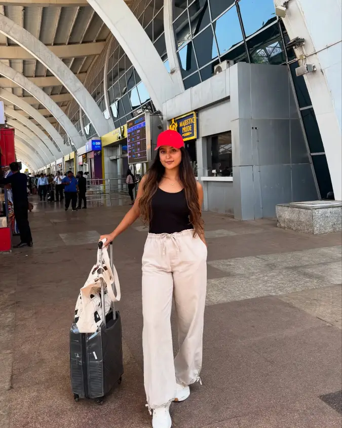 Red Cap with Black Tank and Cream Drawstring Travel Pants
