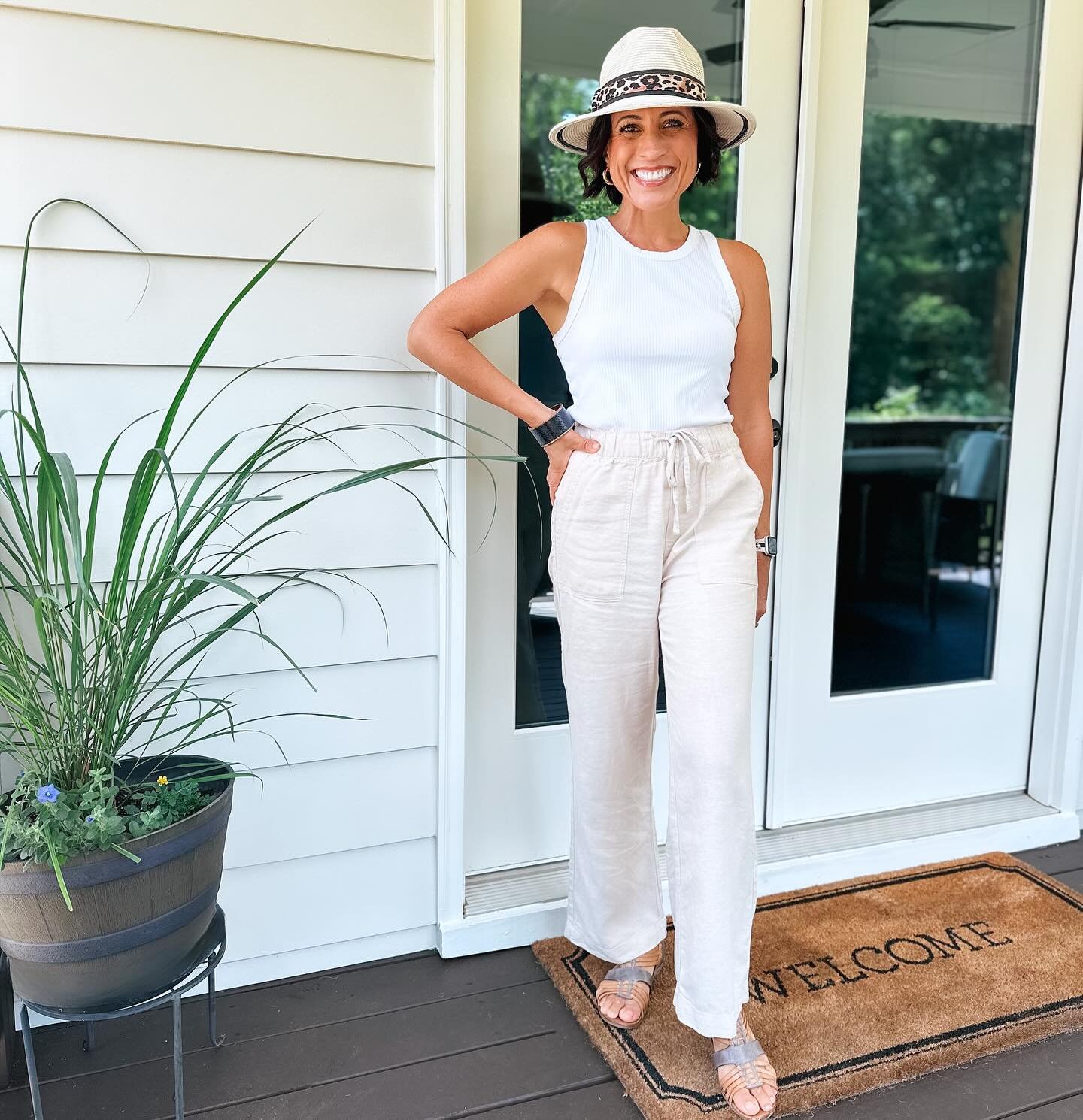 Ribbed White Tank with Beige Linen Trousers and Fedora