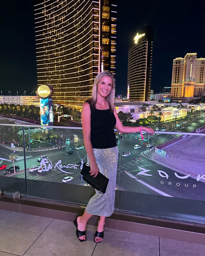 Silver Sequin Midi Skirt on a Night Strip Balcony