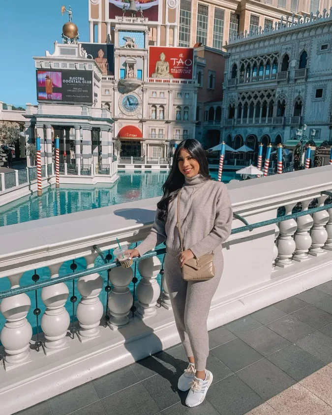 Soft Gray Knit Set with White Sneakers by the Canal