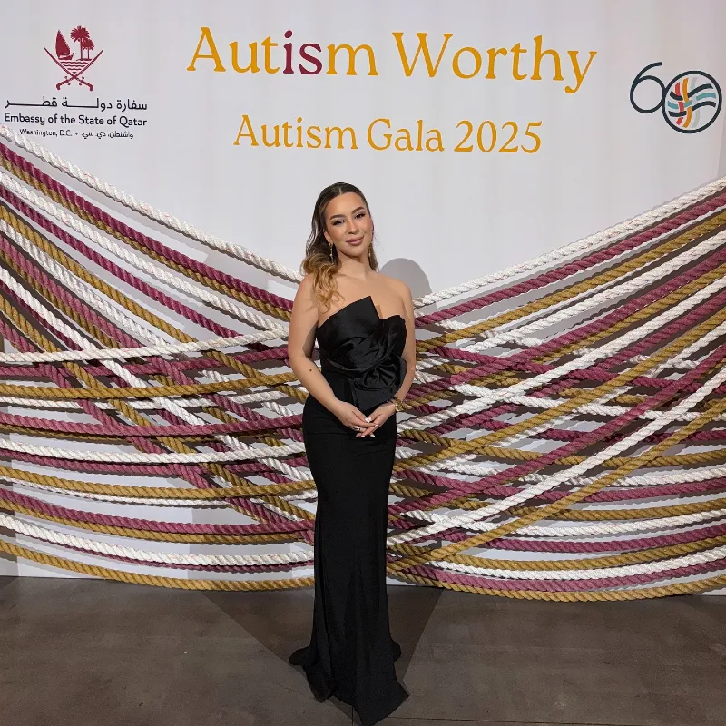 Strapless Black Column Gown with Oversized Bow at Autism Gala Step-and-Repeat