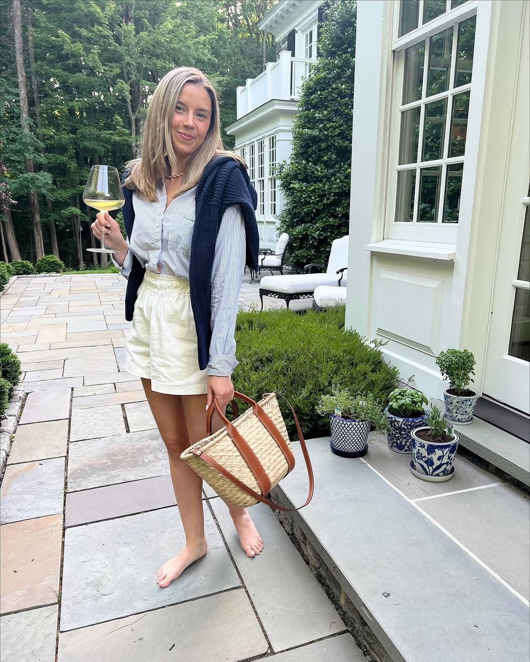 Striped Button-Down with Cream Linen Shorts and a Draped Navy Knit Sweater