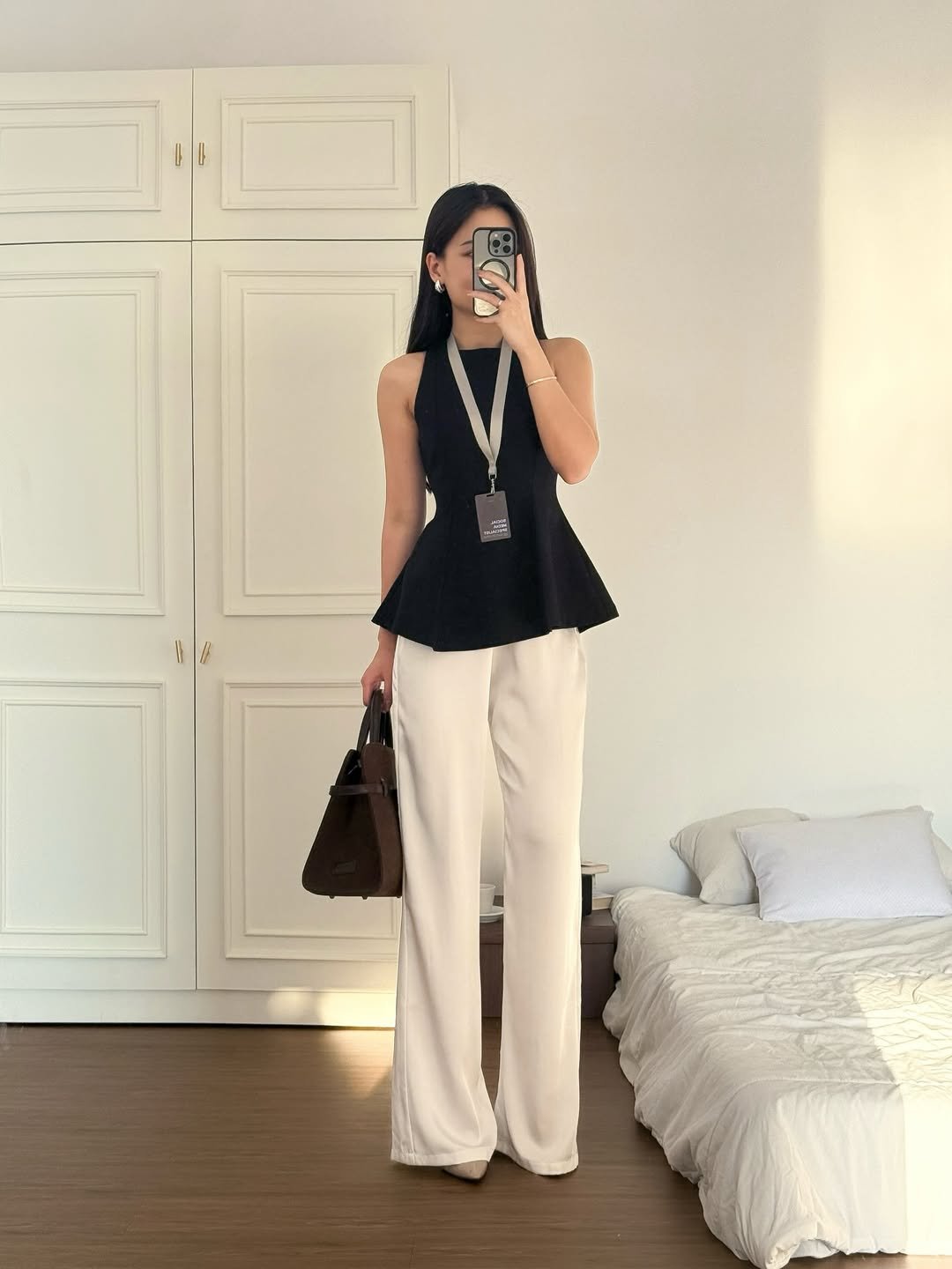 The Monochromatic Peplum and Wide-Leg Trouser Combination