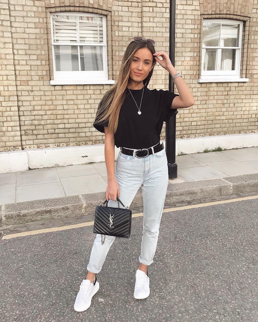 Tucked Black Tee with Light Wash Denim and Chevron Leather Bag