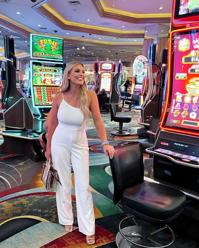White One Shoulder Jumpsuit Under Casino Lights