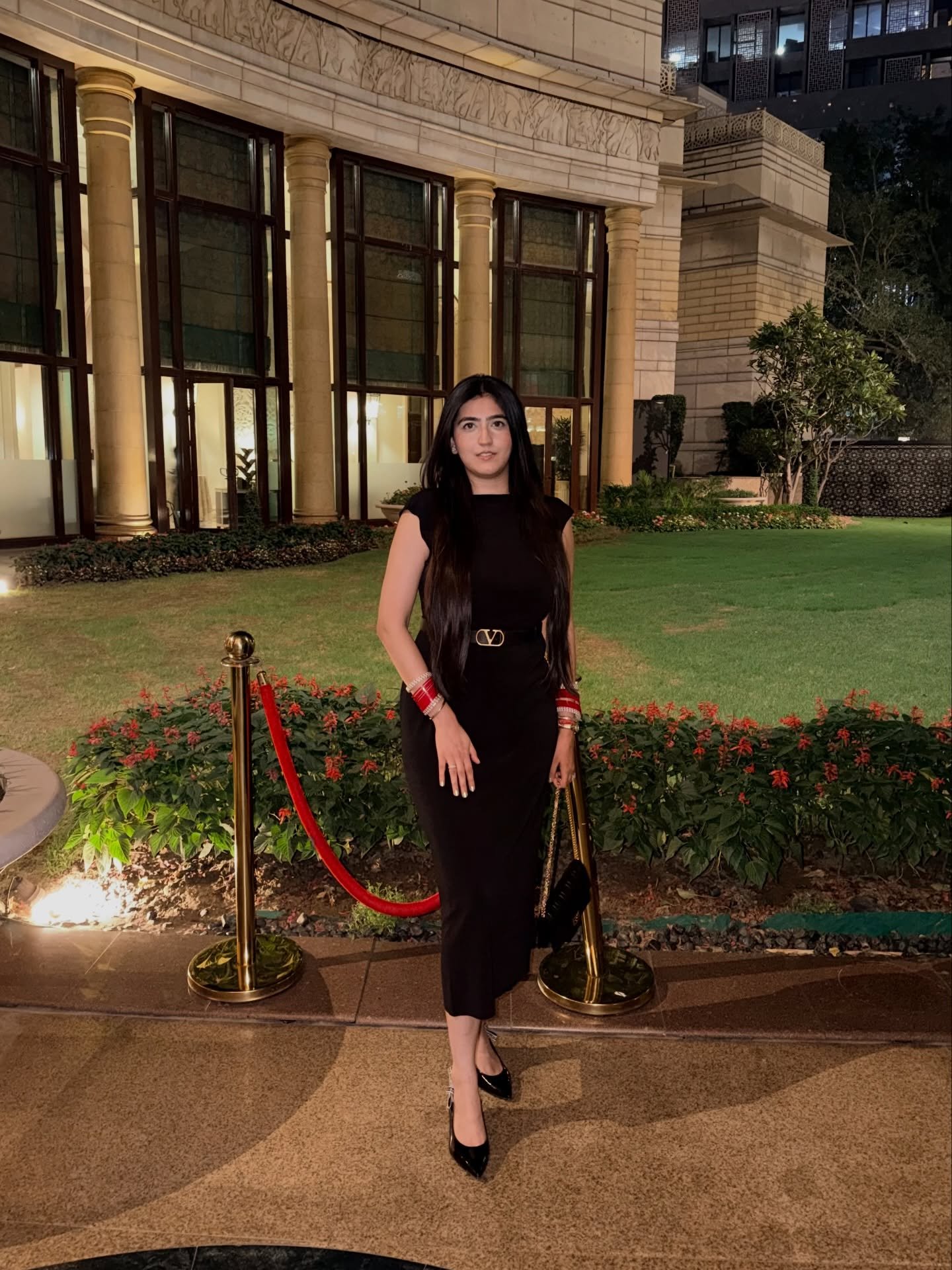 Black Bodycon Midi Dress with Gold Logo Belt and Contrast Bangles