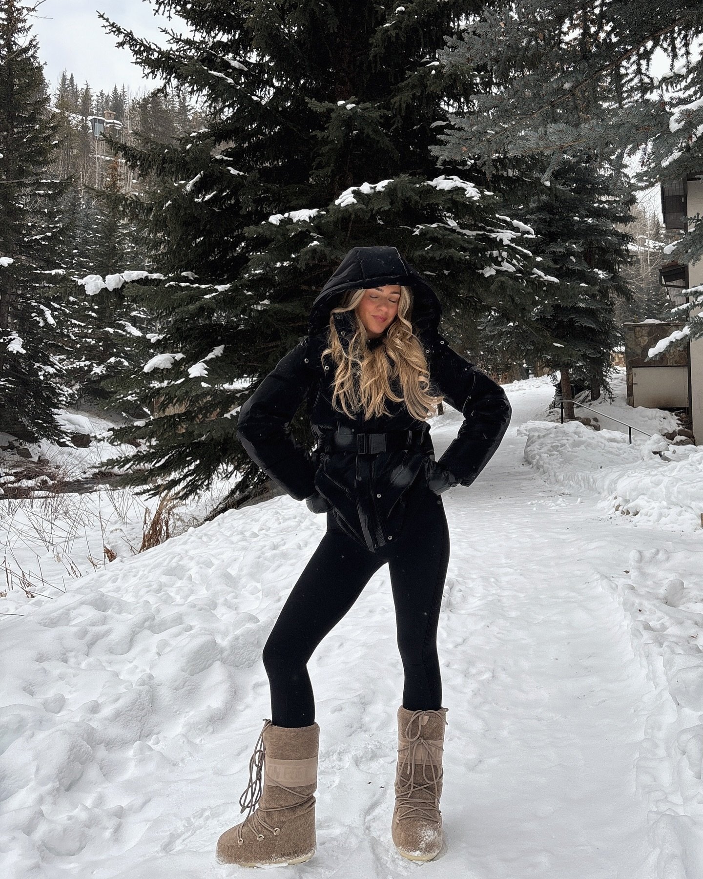 Black Puffer Jacket with Fitted Leggings and Tan Fleece Snow Boots
