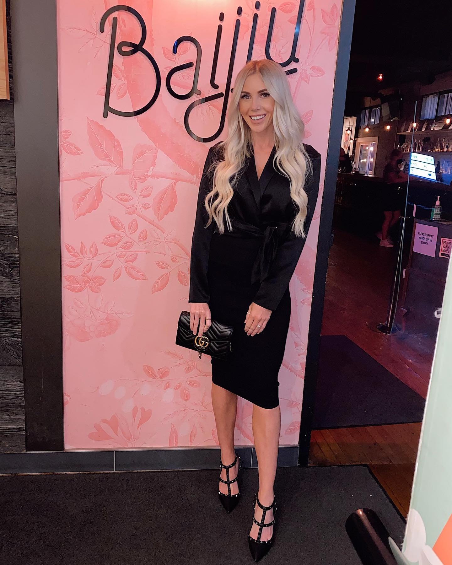 Black Wrap Midi Dress with Quilted Leather Clutch and Studded T-Strap Heels