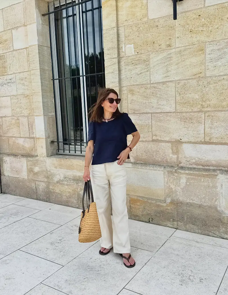 Boxy Navy Linen Blouse with Cream Straight Trousers and Woven Straw Tote