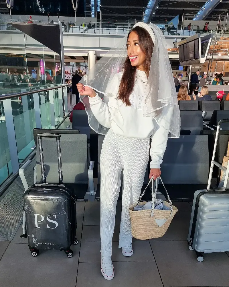Bridal Travel Ensemble with White Pleated Trousers and Veil