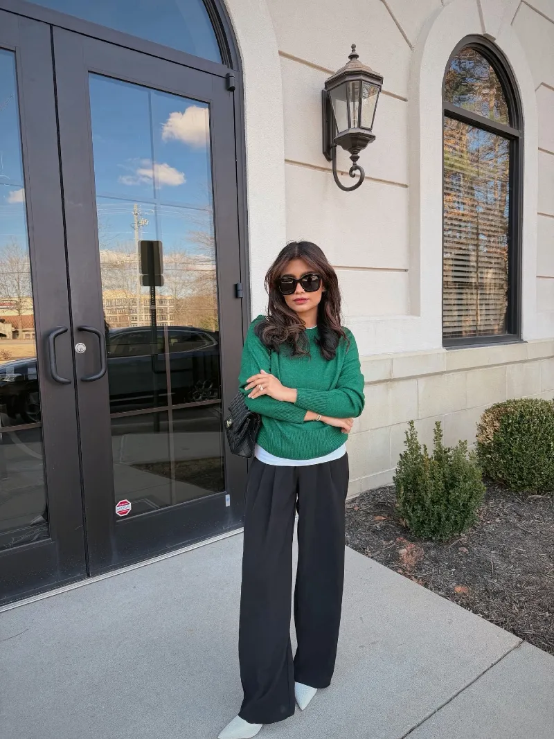 Bright Green Knit Sweater with Peeking White Tee and Wide-Leg Black Trousers