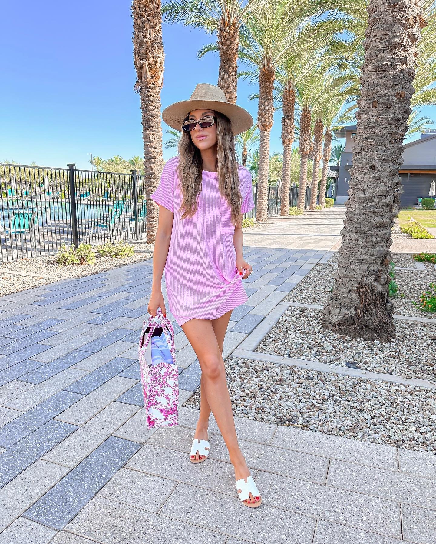 Bright Pink Ribbed T-Shirt Dress with Wide-Brimmed Straw Hat and Patterned Tote