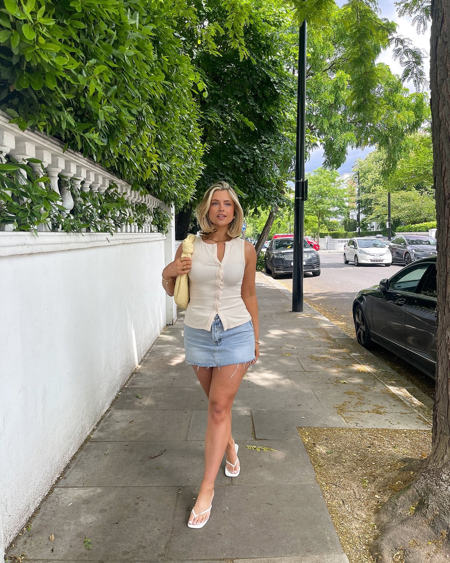 Button-Up White Ribbed Tank with Light Denim Mini Skirt and White Leather Sandals Display