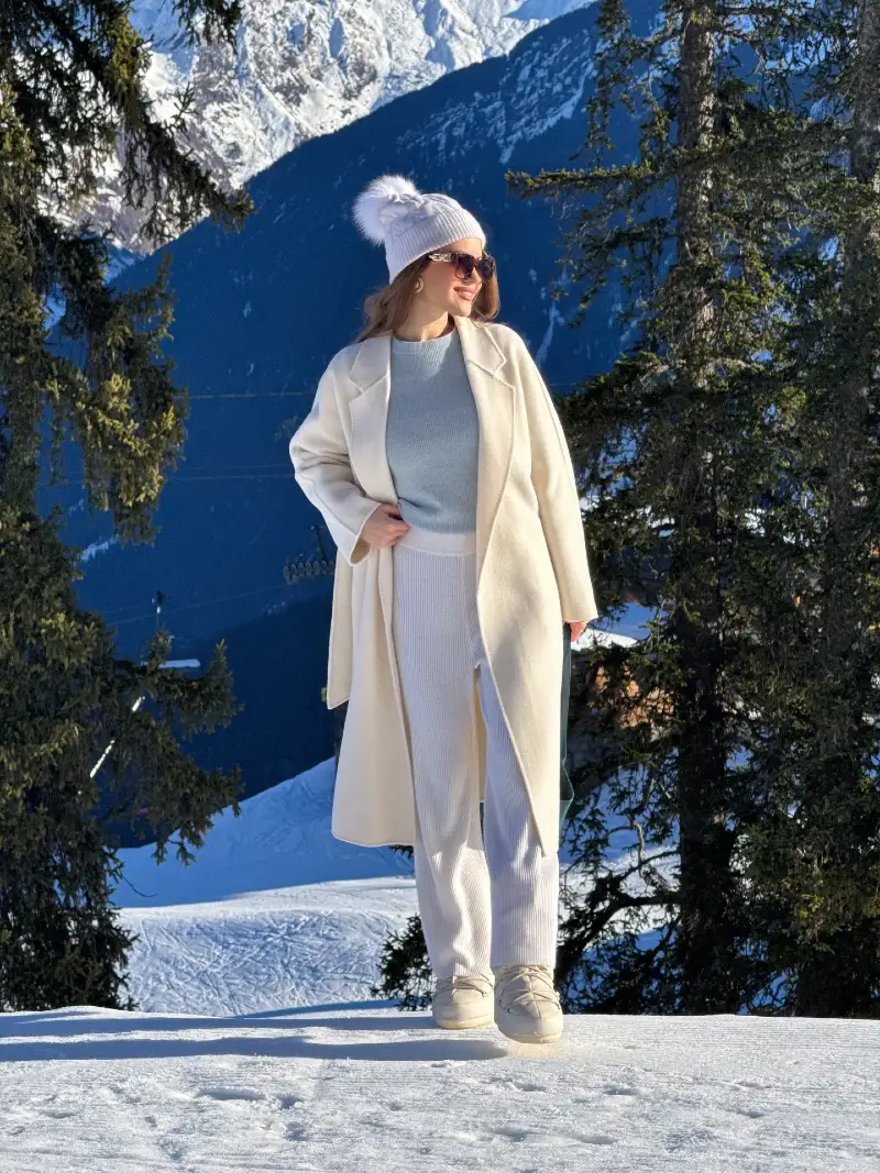 Cream Long Coat with Knit Set, Pom-Pom Beanie, and Snow Boots