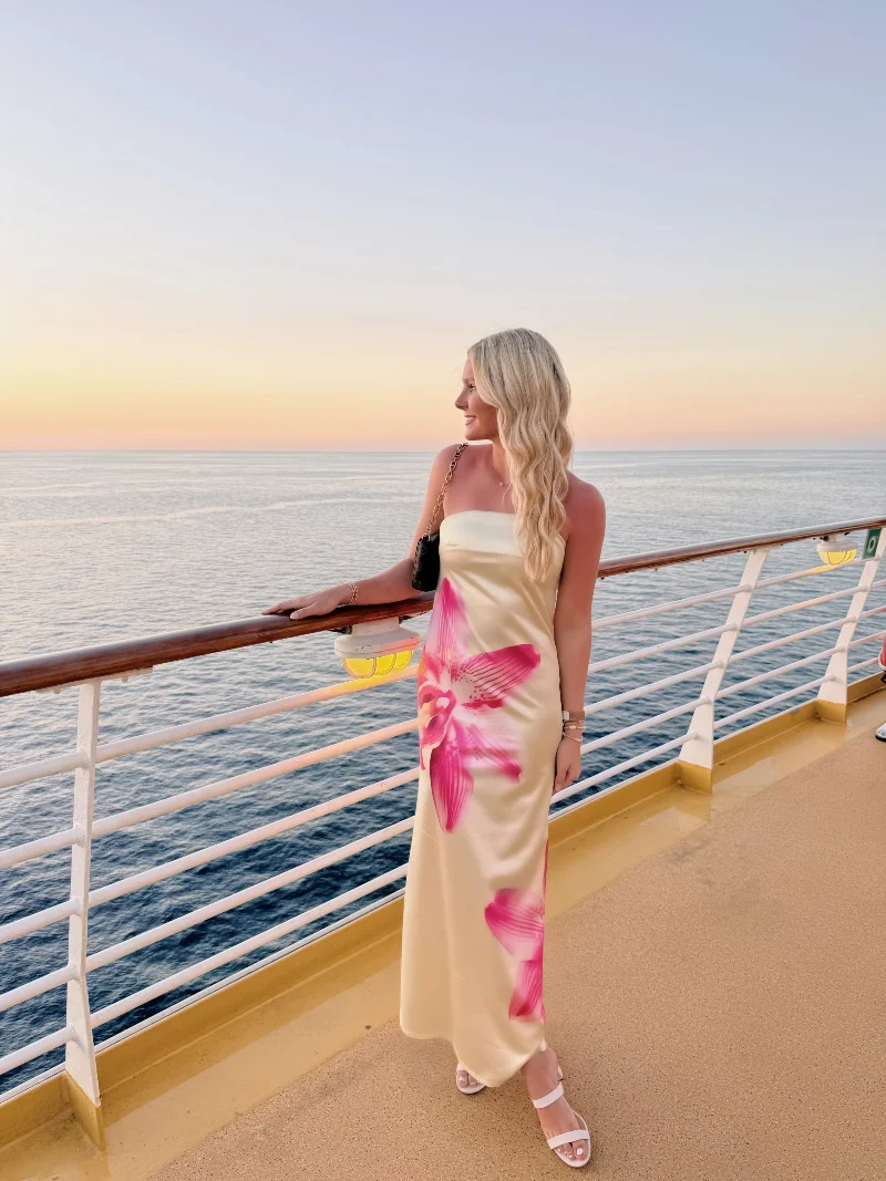 Cream Satin Maxi Dress with Oversized Pink Floral Print and White Strappy Sandals
